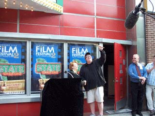 Michael Moore with the key to the State Theatre