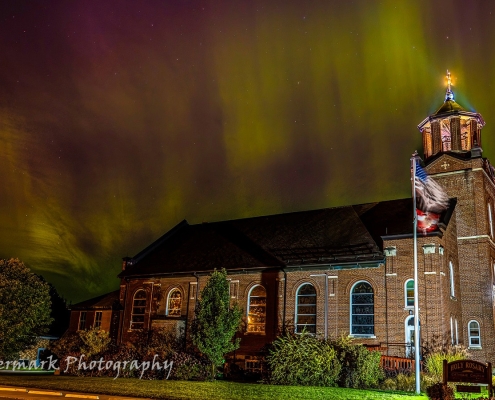 Aurora over Holy Rosary Catholic Church. by Watermark Photography