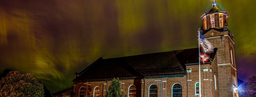 Aurora over Holy Rosary Catholic Church. by Watermark Photography